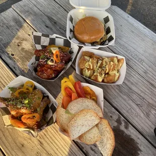 Wings, guacamole, potatoes and burger