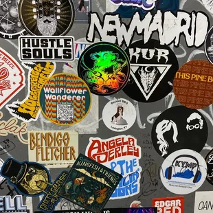 a bunch of stickers on a refrigerator