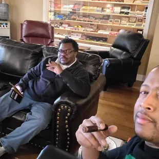 two men sitting in a living room