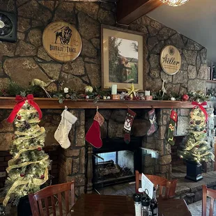 a fireplace and christmas decorations