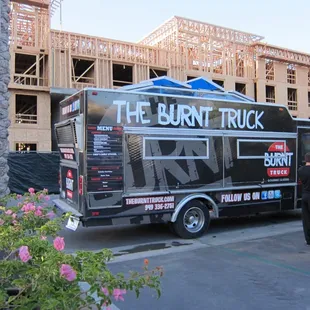 people standing in front of a building under construction