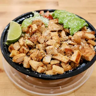 Chicken Bowl with Chipotle Sauce on the side.