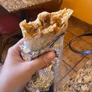 Spicy Pork Regular Burrito (added cheese). Used their red and green salsa on it