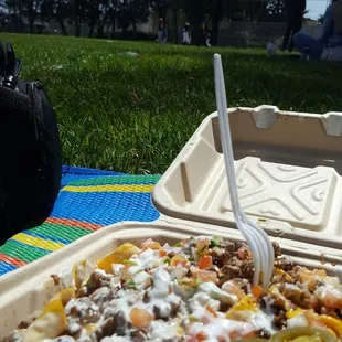 Watching the lil league scrimage with some steak nachos