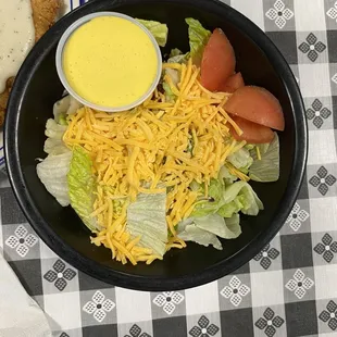 a plate of salad and a sandwich