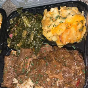 Oxtails Over a Bed of Rice, Greens, &amp; Mac n cheese