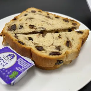  a piece of bread and a packet of yogurt