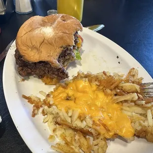 06 Feb 2024 Half-eaten Better Cheddar burger with hashbrowns.