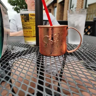 a copper mug on a table