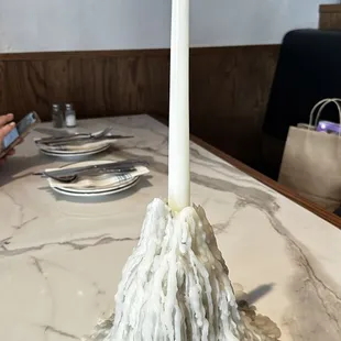 Small kine fascinated by the mountain of wax