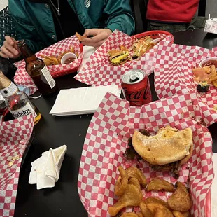 Burger, pulled pork, pastrami and a burger cut in half for the kids to share