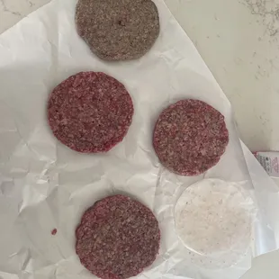 four hamburger patties