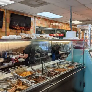 a woman standing in front of the counter