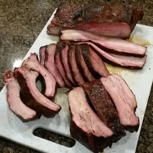 Delicious selection of smoked meats on a Sunday, pork belly ($12.99/lb), tri tip (amazing @ $24.99/lb), baby backs, &amp; spare ribs