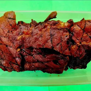 a piece of meat in a plastic container