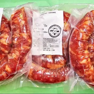three sausages wrapped in plastic