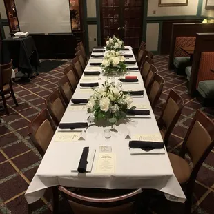 a long table with place settings