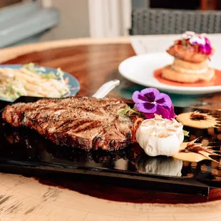 Our Porterhouse and assortment of signature dishes.