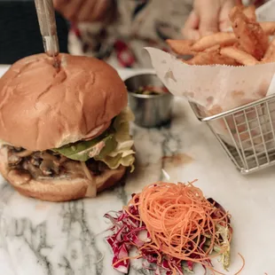 Our 1lb Vegan Burger with two large soy patties, caramelized onions, wild mushrooms and avocado.