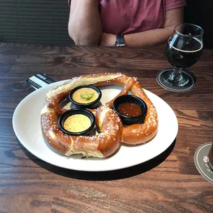 a plate of pretzels and beer