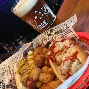 a basket of food and a glass of beer