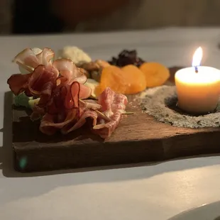 Charcuterie board with edible beef Tallow Candle. So amazing.