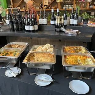 a buffet of food and wine