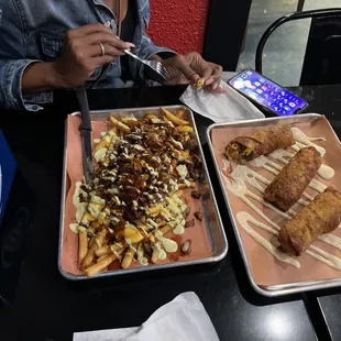 Florida fries with brisket and thick cut bacon and butthutt eggrollsdeliciousness