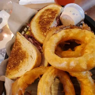 Reuben sandwich $12, added battered dipped onion rings $3.50, and 16oz Blake's hard cider $6