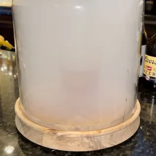 a glass covered cake dish