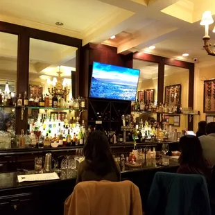 At the bar.
