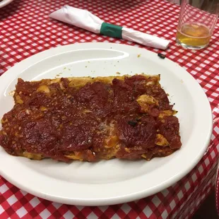 a slice of pizza on a plate