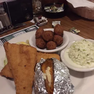 Fried fish with sweet potato, hush puppies and coleslaw