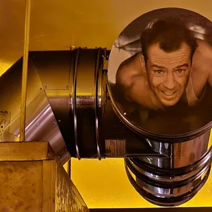 John McClane says Yipee Ki-yay from the vent