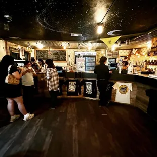 a group of people at a bar
