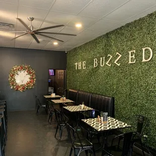 a dining area with tables and chairs