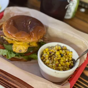 The classic burger (add bacon &amp; avocado) with corn