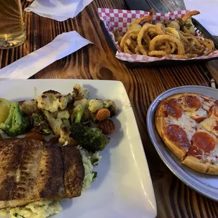 Blackened grilled salmon with rice and grilled vegetables. Kid&apos;s pepperoni pizza. Shrimp jalapeño poppers.