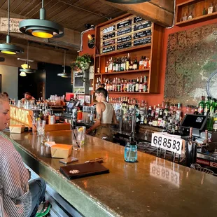a woman sitting at a bar