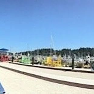 Panoramic photo of the outdoor seating area and bocce ball courts