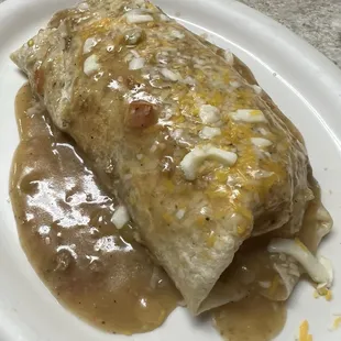 Breakfast Burrito smothered in Green Chili.
