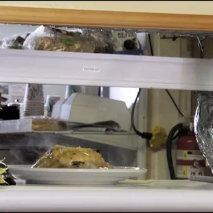 The Cabin Restaurant is definitely "old school," as when the kitchen has cooked your meal, it's placed on a shelf and a bell is "dinged" an