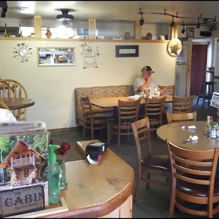 The main dining room of The Cabin Restaurant,  as you enter the dining room, just past the "welcome" board.