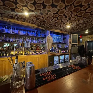 a bar with a lot of bottles