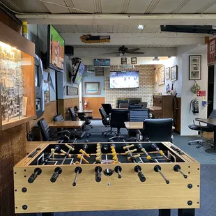 a foosball table in a game room