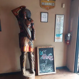 a wooden statue of a man