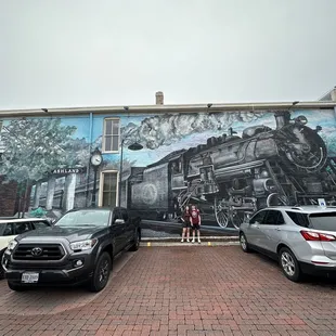 a mural of a train