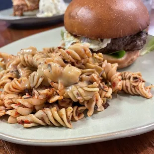 Seasonal burger train signature dish with pasta salad