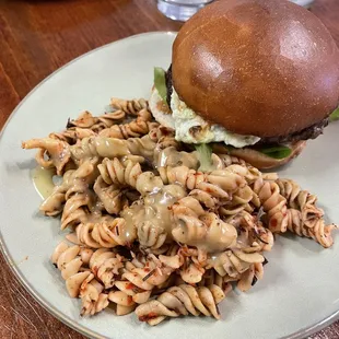 Seasonal burger train signature dish with pasta salad