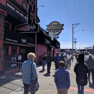 a group of people walking down the street
